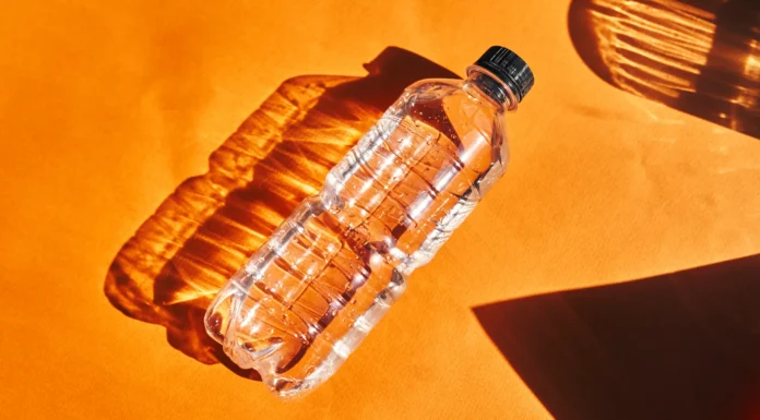 Why You Should Toss a Water Bottle Under Your Hotel Bed
